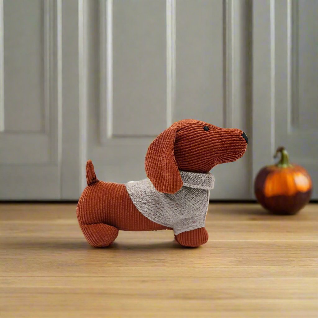 ORANGE DOG WITH JUMPER DOOR STOP